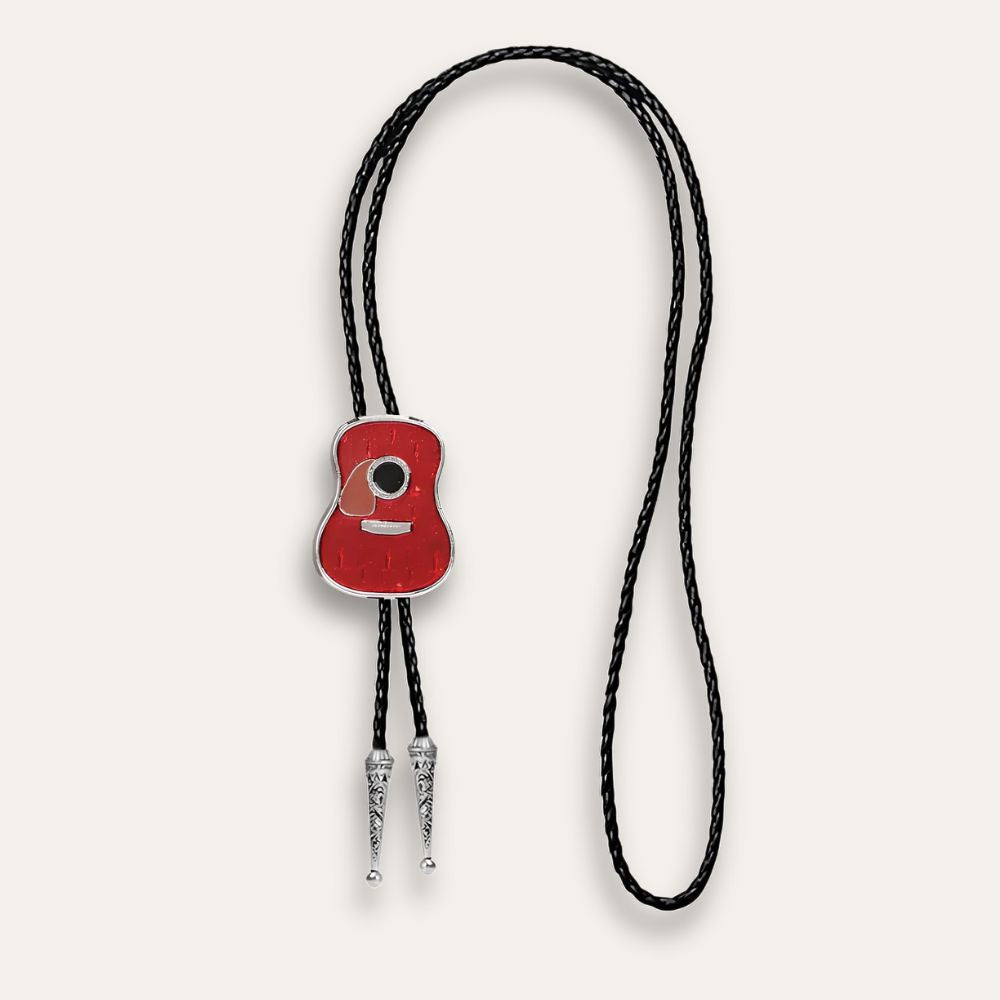 Red guitar bolo tie laid out at full length, cord tips showing