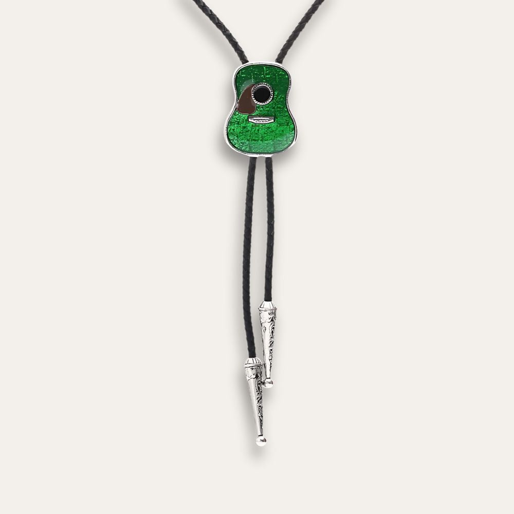 Green guitar bolo tie hanging at full length, cord tips showing